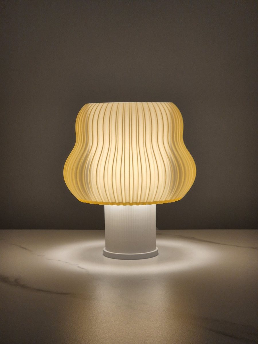 Warm Sand Wave lamp glowing in a dark room