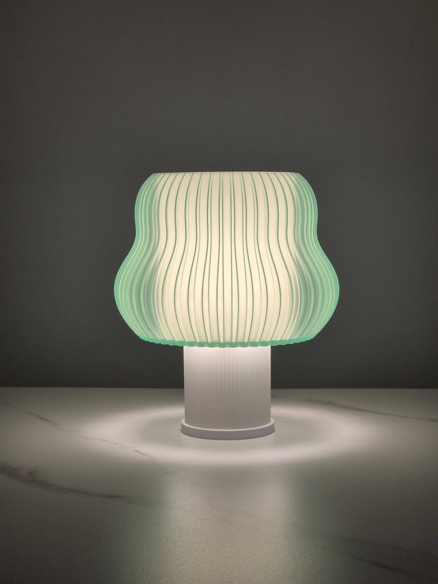 Sage Mist Wave lamp glowing in a dark room